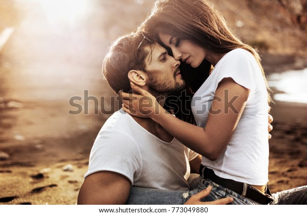 Handsome Man Hugging His Woman On Stock Photo (Edit Now) 773049880