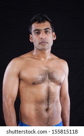 Handsome Man From India Standing Shirtless With Hair On His Chest And Well Defined Muscles Handsome Man From India Standing Shirtless With Hair On His Chest And Well Defined Muscles