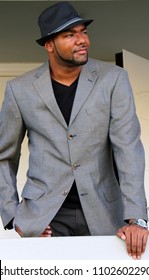 Handsome man in jacket and hat