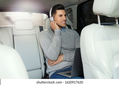 Handsome Man Listening To Audiobook In Car