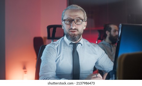 Handsome Man In Middle Aged Suit Employer Is Working On A Joint Project With His Young Employee