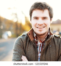 Handsome Man Outdoors Portrait. Autumn Colors.