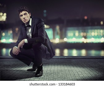 Handsome Man Over Night City Background