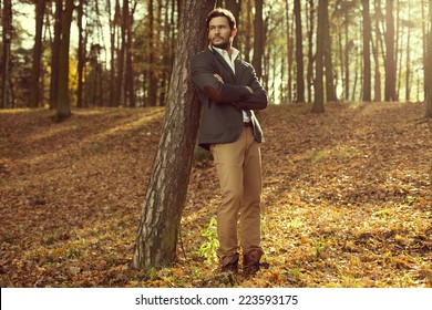 Handsome Man In The Park. Autumn Scenery