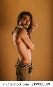 Handsome Man Posing With His Bearded Dragon And His California King Snake At The Studio