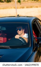 Handsome Man Posing Inside Sports Car.