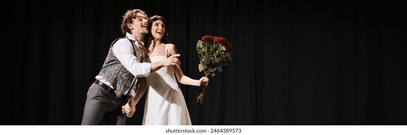 Handsome man presenting bouquet to beautiful woman during theater rehearsal. - Powered by Shutterstock