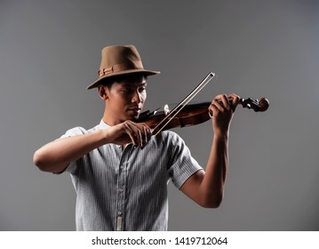 The Handsome Man Put Bow Touch On String,show How To Play Violin ,the Acoustic Instrument