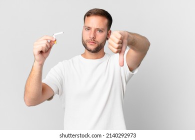 Handsome Man Quitting Smoking With A Broken Cigar