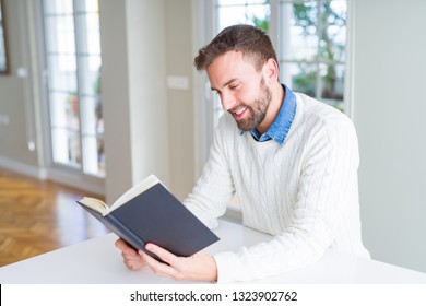 Handsome Man Reading A Book At Home