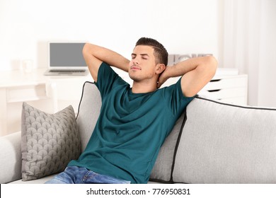 Handsome man resting on sofa at home - Shutterstock ID 776950831