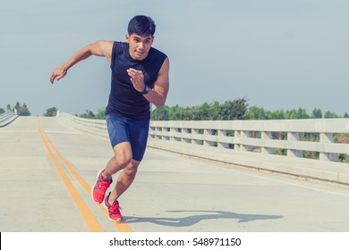 Handsome Man Running And Physical Fitness Test On Bridge ; Healthy Lifestyle Cardio Together At Outdoors Summer 

