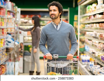 Handsome Man Shopping In A Supermarket