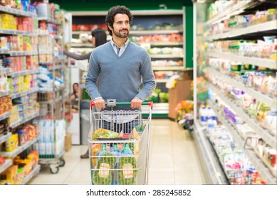 Handsome Man Shopping In A Supermarket