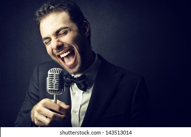 Handsome Man Singing With Microphone