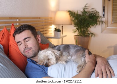 Handsome man sleeping with this dog