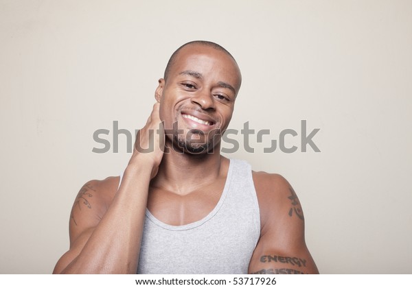 Handsome Man Smiling Rubbing His Neck Stock Photo (Edit Now) 53717926