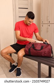 Handsome Man With Sports Bag In Locker Room