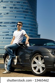 Handsome Man Standing Near The Modern Sport Car