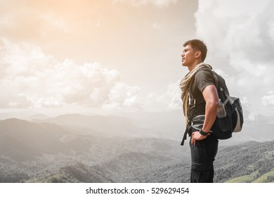 handsome man standing on mountain peaks and looking to start point ; hikers walking to mountain with his goal to freedom
 - Shutterstock ID 529629454