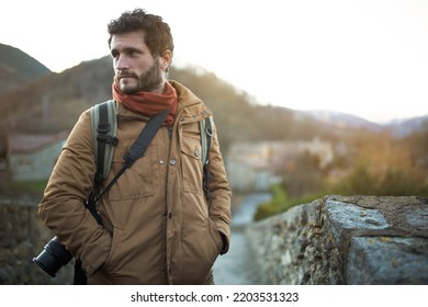 Handsome Man Standing Outdoors In Nature In Winter. Male Photographer Going On Trekking, Hiking Adventure. Copy Space.