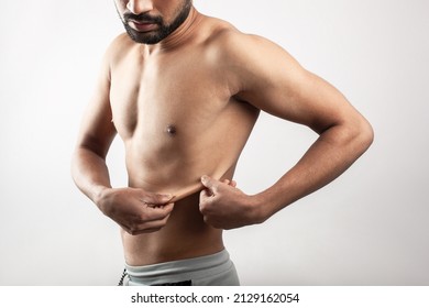 Handsome Man Stretching Skin On The Thoracic Cage Area Showing The Body Fat.