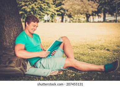 Handsome Man Student In A City Park On Summer Day 