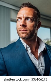 Handsome Man In Suit Looking Off-camera With Furrowed Brow