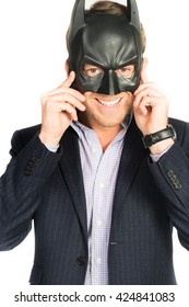 Handsome Man In Suit Wearing A Batman Mask Isolated