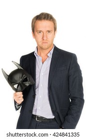 Handsome Man In Suit Wearing A Batman Mask Isolated