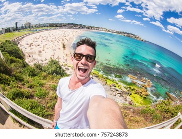 Handsome man taking a selfie on vacation - Powered by Shutterstock