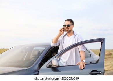 Handsome Man Talking By Mobile Phone Near His Modern Car