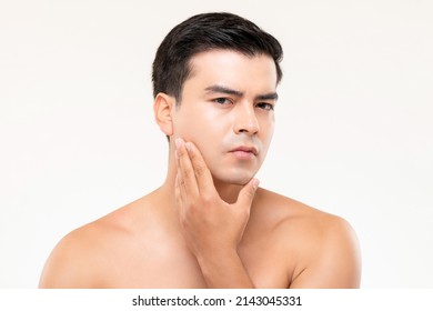 Handsome Man Touching His Face Checking For Skin Problems And Wrinkles In White Isolated Background