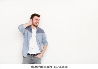 Handsome Man Touching His Hair. Young Confident Guy In Relaxed Pose, Isolated On White Background. Flirt, Seduction Concept