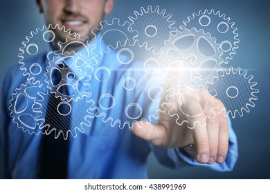Handsome man touching icon on virtual screen - Shutterstock ID 438991969