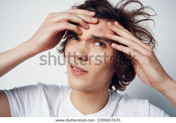 Handsome Man Tousled Hair Holds His Stock Photo Edit Now 1300607635