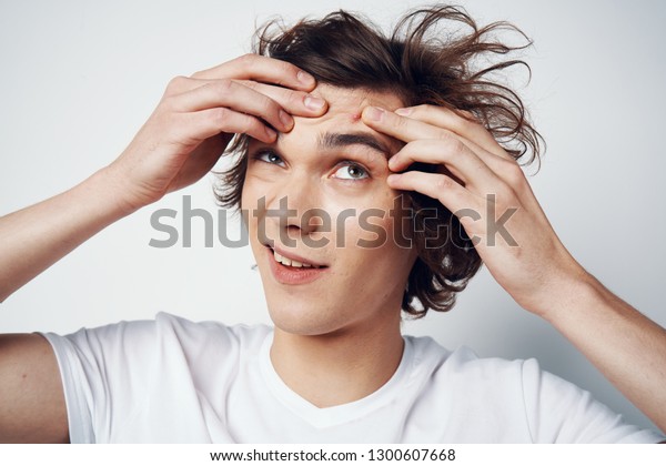 Handsome Man Tousled Hair Holds His Stock Photo Edit Now 1300607668