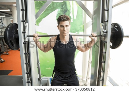 Similar – Image, Stock Photo Young sportsman drinking water after jogging