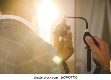 Handsome Man Is Using Vintage Atomizer Nozzle With Perfume