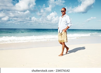 Handsome Man Walking On Sandy Beach Stock Photo (Edit Now) 233423005