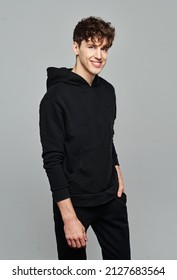 Handsome Man Wear Black Set Of Track Suit Isolated On Gray Background