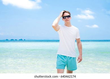 Handsome Man Wearing Casual Clothes And Sunglasses At The Beach In Summer