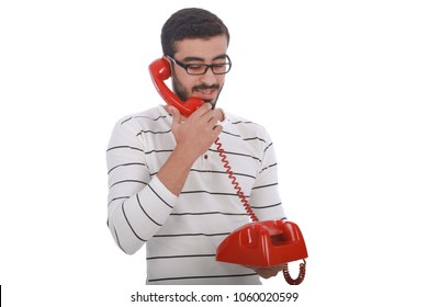 Handsome Man Wearing A Casual Outfit,  Talking On The Landline, Isolated On White Background.