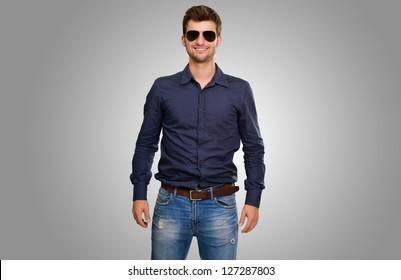 Handsome Man Wearing Shirt Against A Grey Background