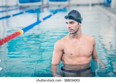 Handsome Man Wearing Swim Cap And Goggles At The Pool