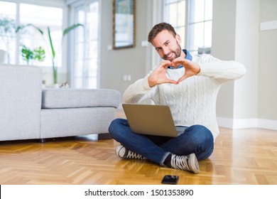 Handsome Man Wearing Working Using Computer Laptop Smiling In Love Showing Heart Symbol And Shape With Hands. Romantic Concept.