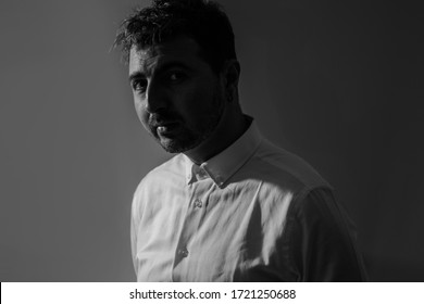 Handsome Man In White Shirt, Black And White Portrait Photography, Low Light, Headshot, Not Smiling, Serious And Confident Young Man Looking Camera 