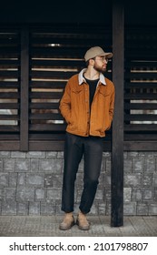 Handsome man in winter jacket posing in the street