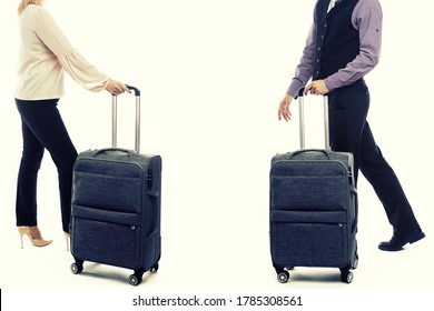 Handsome man and woman walking with luggage. Side view of young couple on white background - image