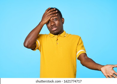 Handsome man yellow t-shirt emotions Studio - Shutterstock ID 1621774717